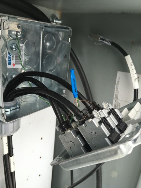 Tower patch panel with shielded connectors.